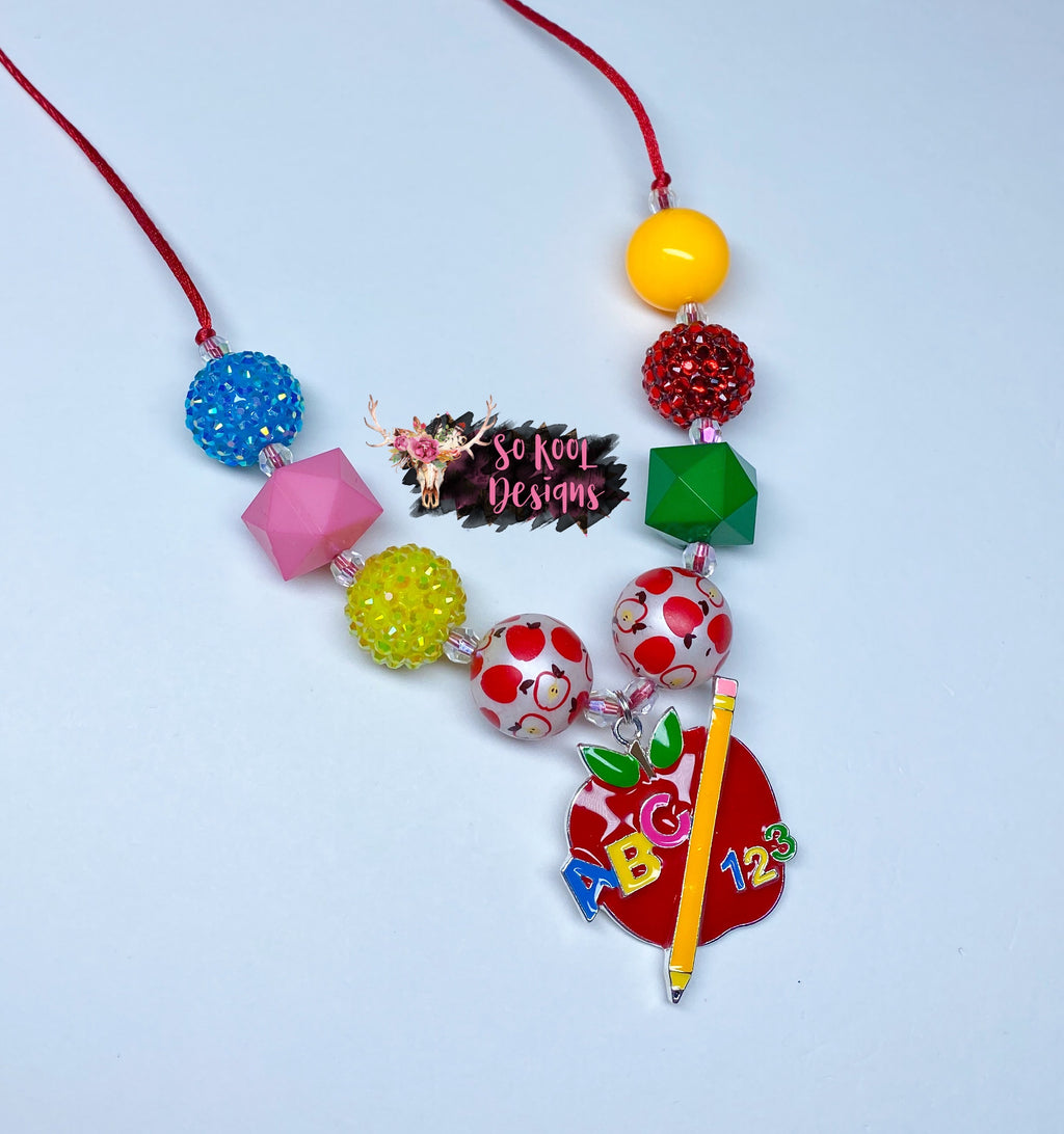 Colorful apple & pencil pendant with beads to match