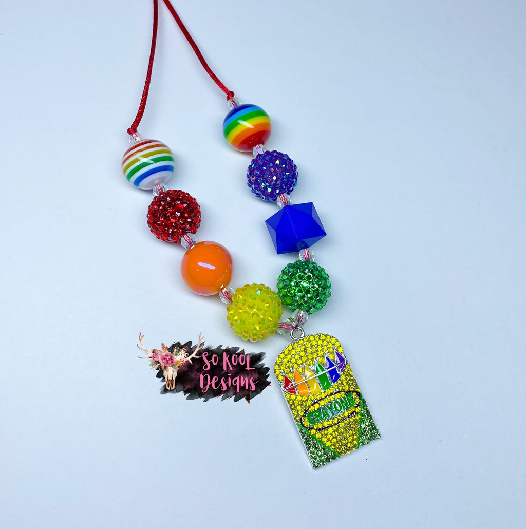 Rhinestone crayon pendant with matching beads